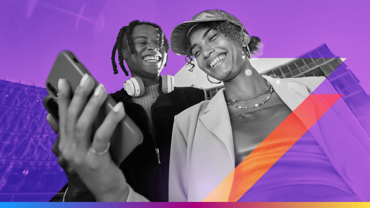 two people laughing - looking at a phone - featured image for IDC CDP 2025 satisfaction rankings article