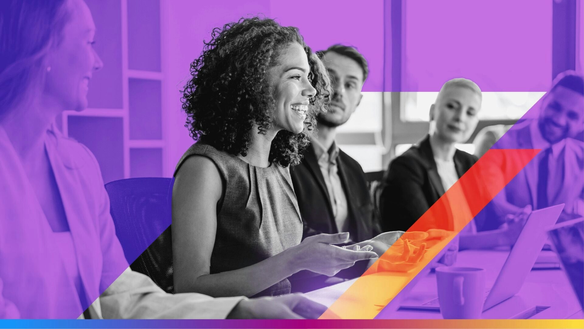 image of a group of coworkers around a conference table - used as featured image for the award-winning email campaigns article